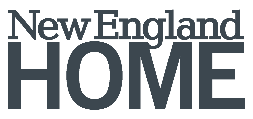 Text graphic that says 'New England Home' in dark gray font.