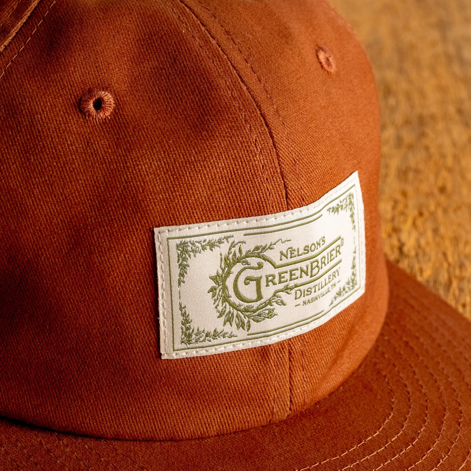NG retail orange woven patch hat front detail.jpg