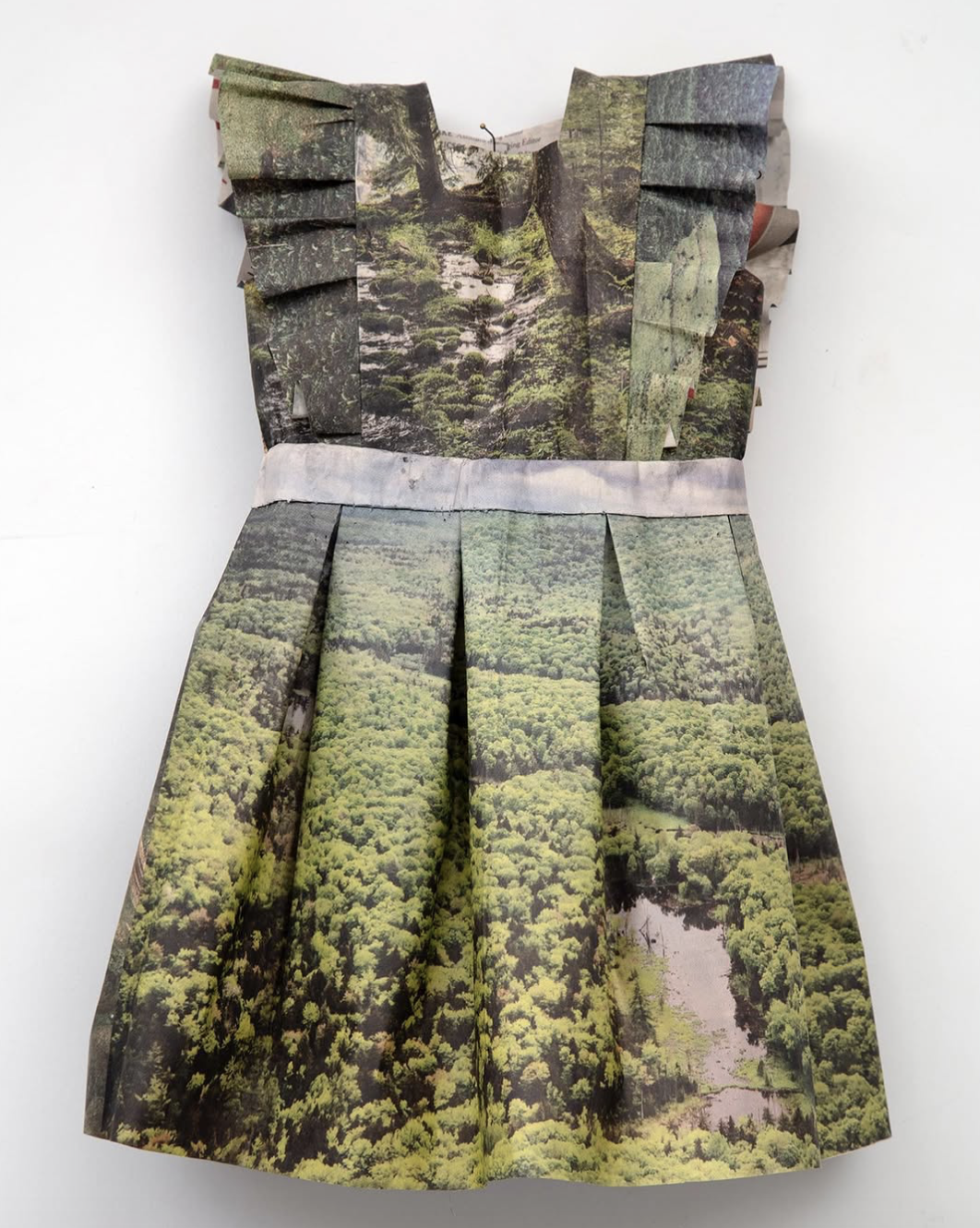  NEW YORK TIMES LITTLE DRESS XXII   
 Newspaper and thread  
12" x 9"  
2019  
 