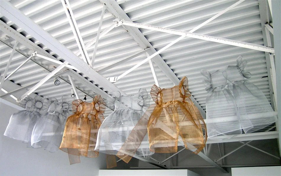  SHORT MEMORIES    Aluminum and copper screening and wire dresses  12" X 12" X 24" (dimensions variable)  2004  