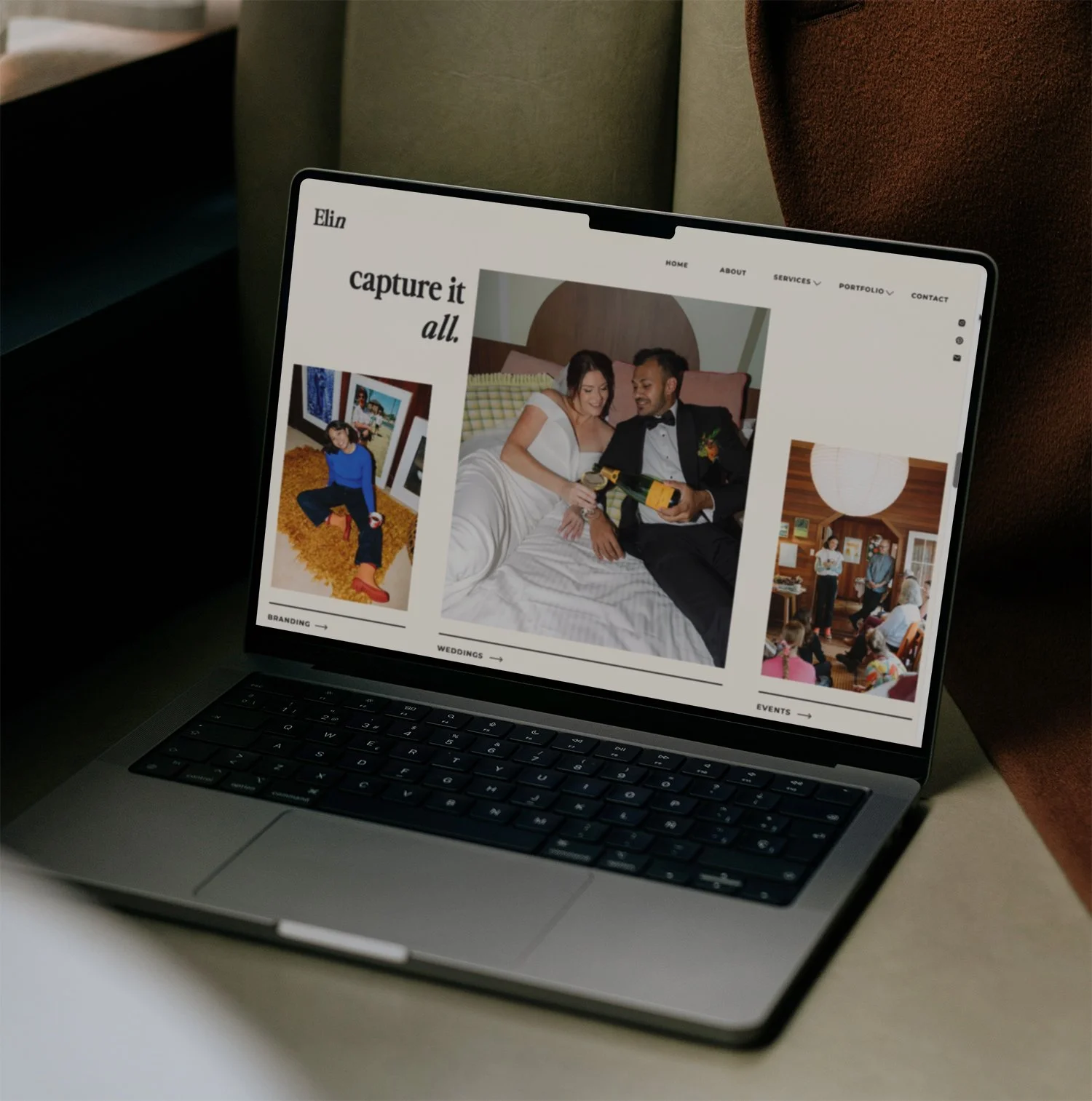A laptop displaying a photography website with images of a woman in a blue top, a wedding scene with a bride and groom, and an event with children. The website header reads "capture it all."