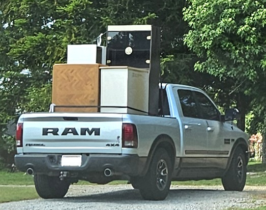 Pickup truck filled with donated furniture and appliances ready for delivery through Faith in Action’s furniture ministry in Douglas County, GA.
