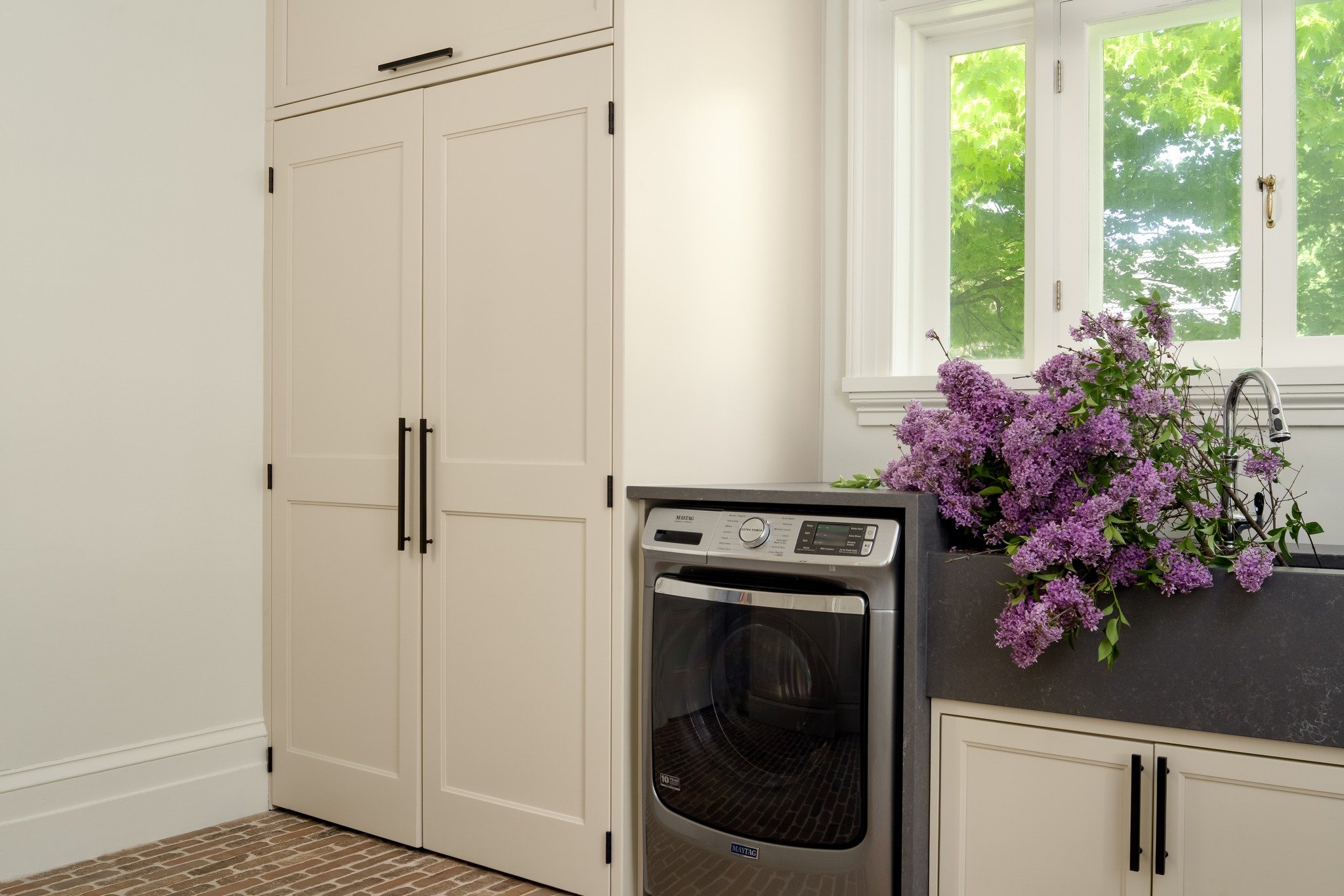 Hold the Dots and Scroll for a Surprise 👀

For #TheHeritageEdit, we had to get really intentional with the square footage. The goal was a space that works overtime: a high-functioning laundry room by day, and a chic, professional salon when it&rsquo