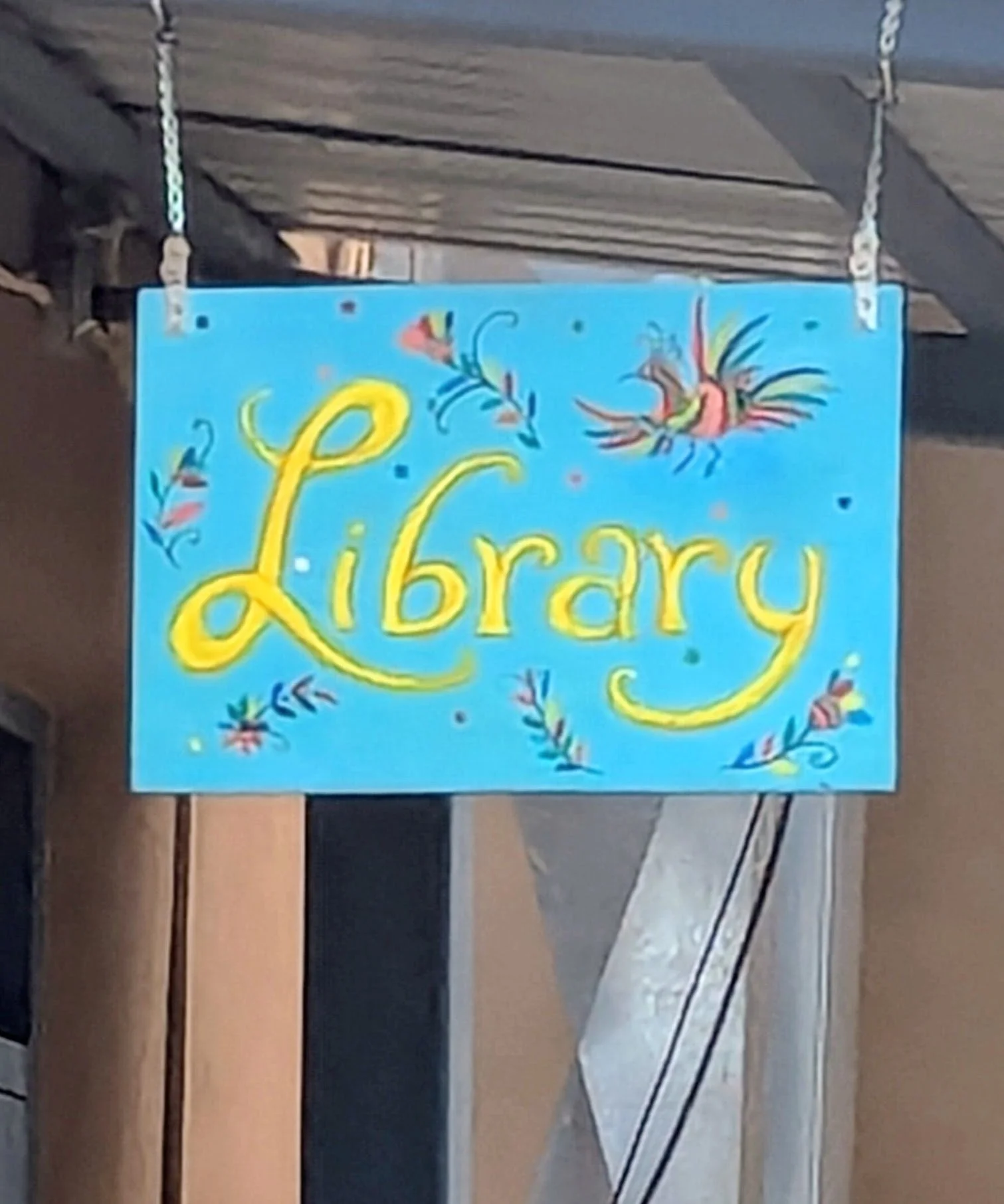 La Cienega Valley Library sign hanging by entrance door