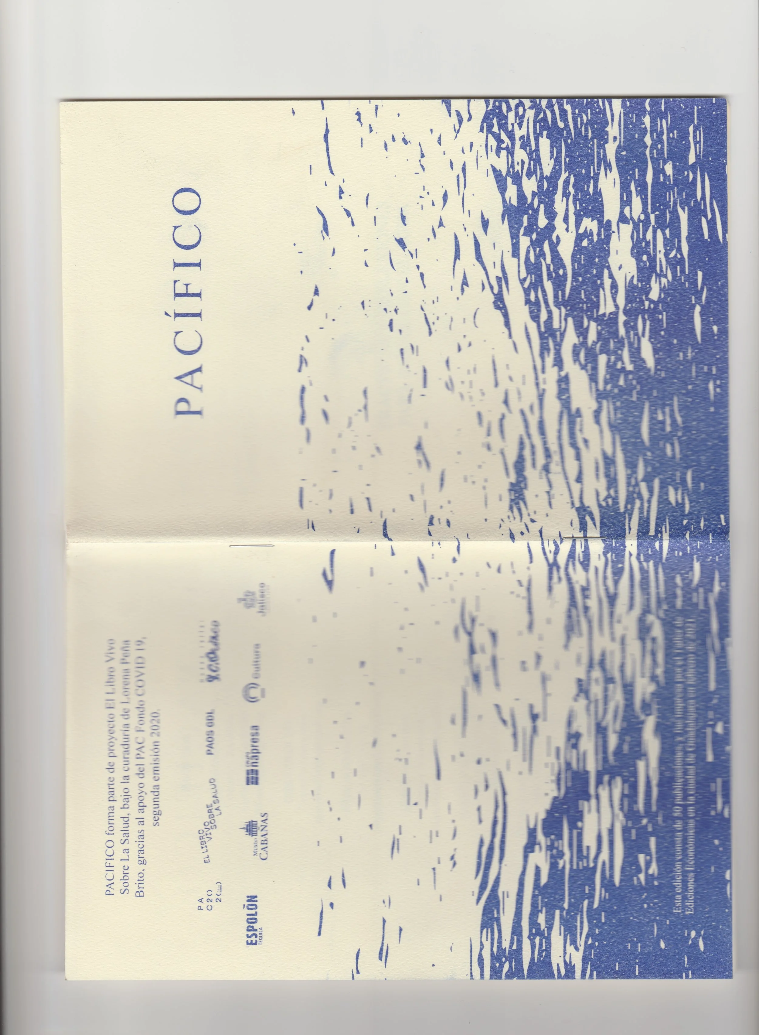 A booklet titled 'PACÍFICO' with a blue and white design of water and waves on the cover.