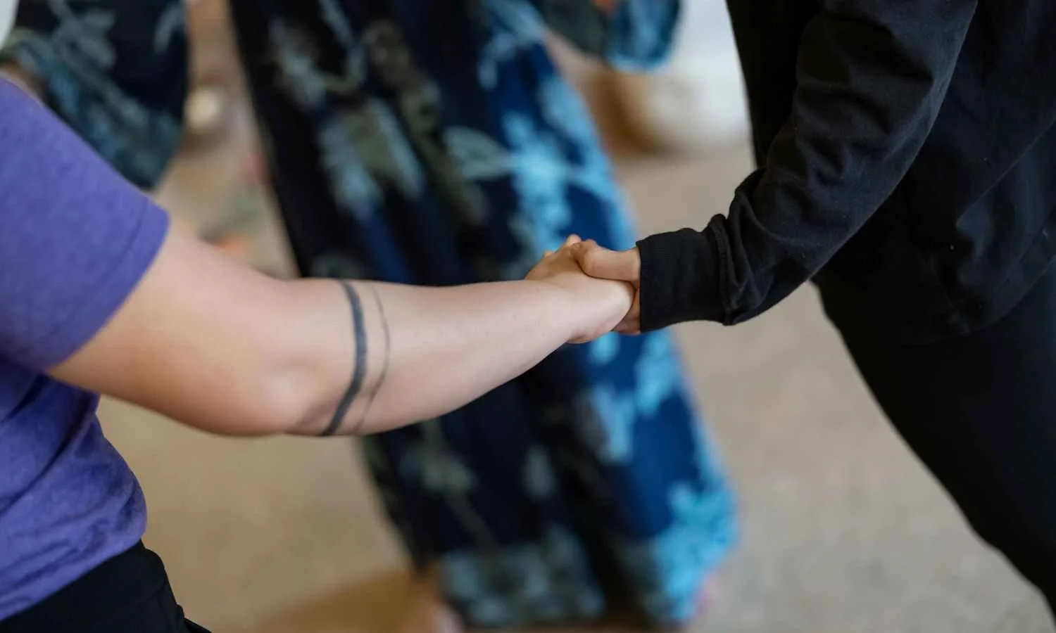 Women in a circle holding hands