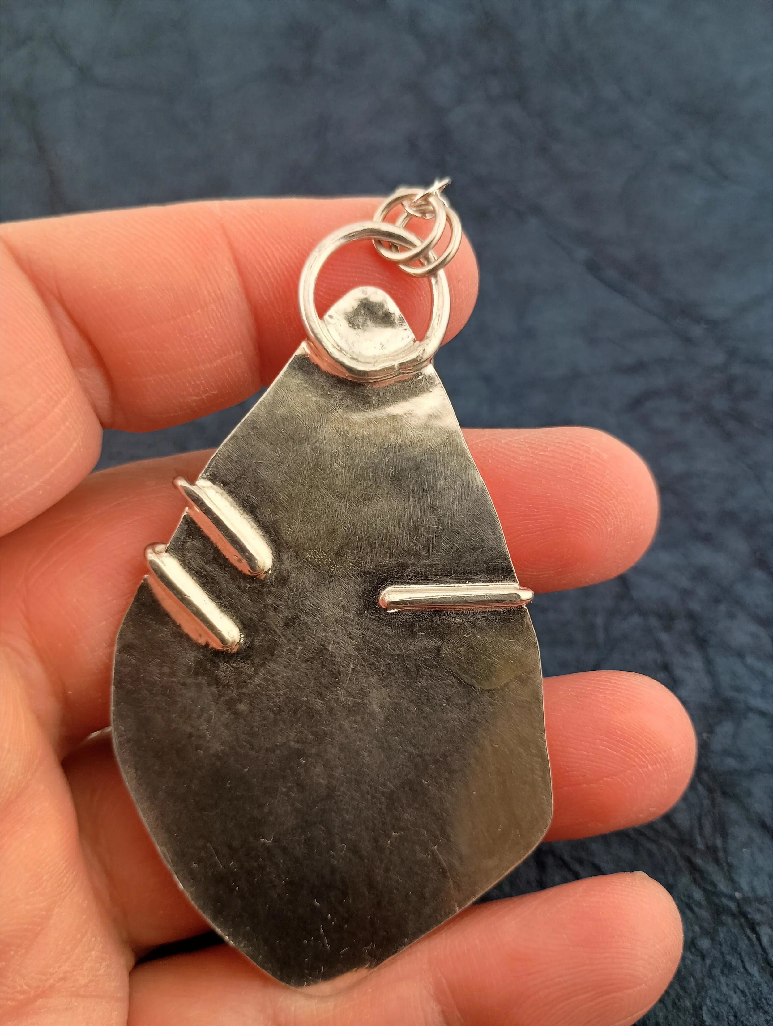 crazy lace agate in hand back view.JPG