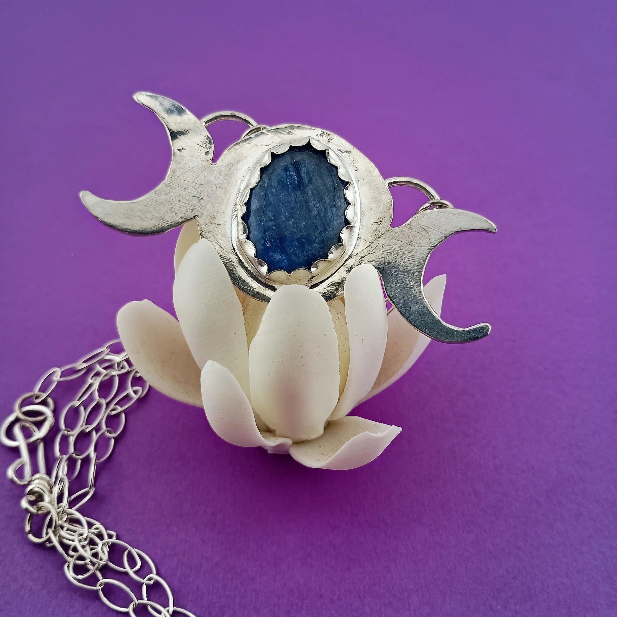 Kyanite Triple moon purple background white lotus.JPG
