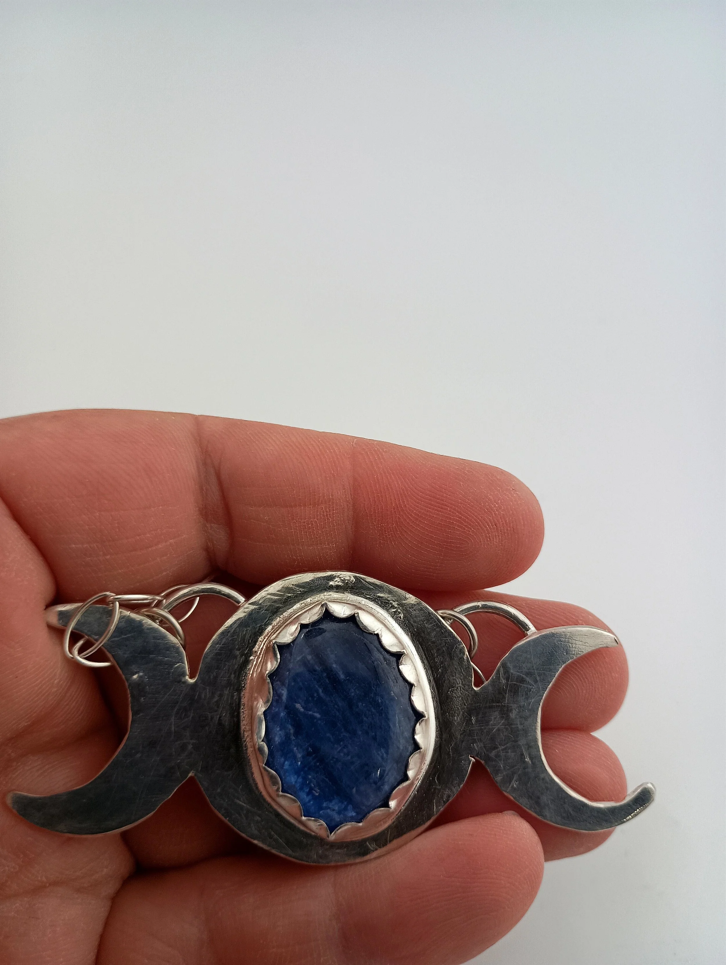 kyanite triple moon in hand.JPG