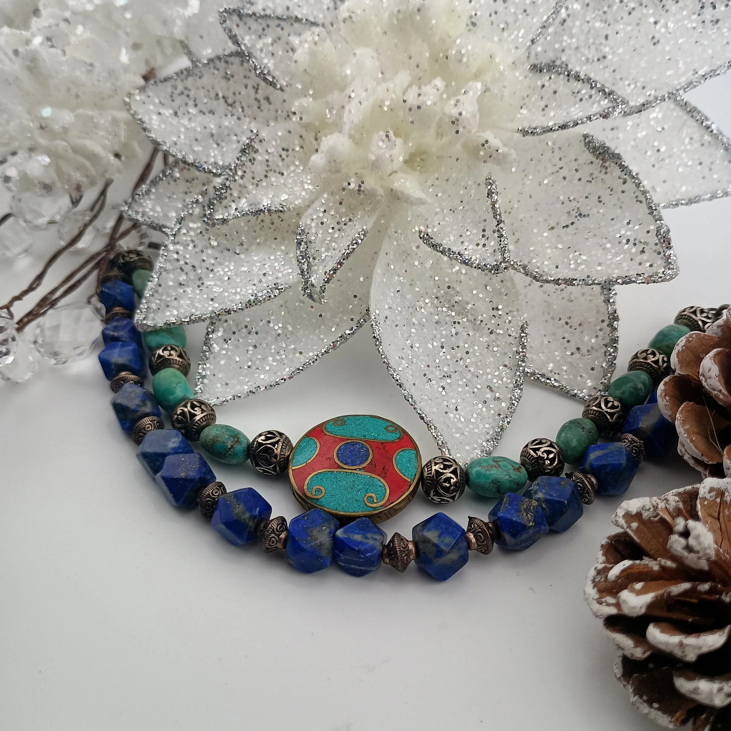 SGBB8 Tibetan 2 strand bracelet Poinsettia pinecones close up.JPG