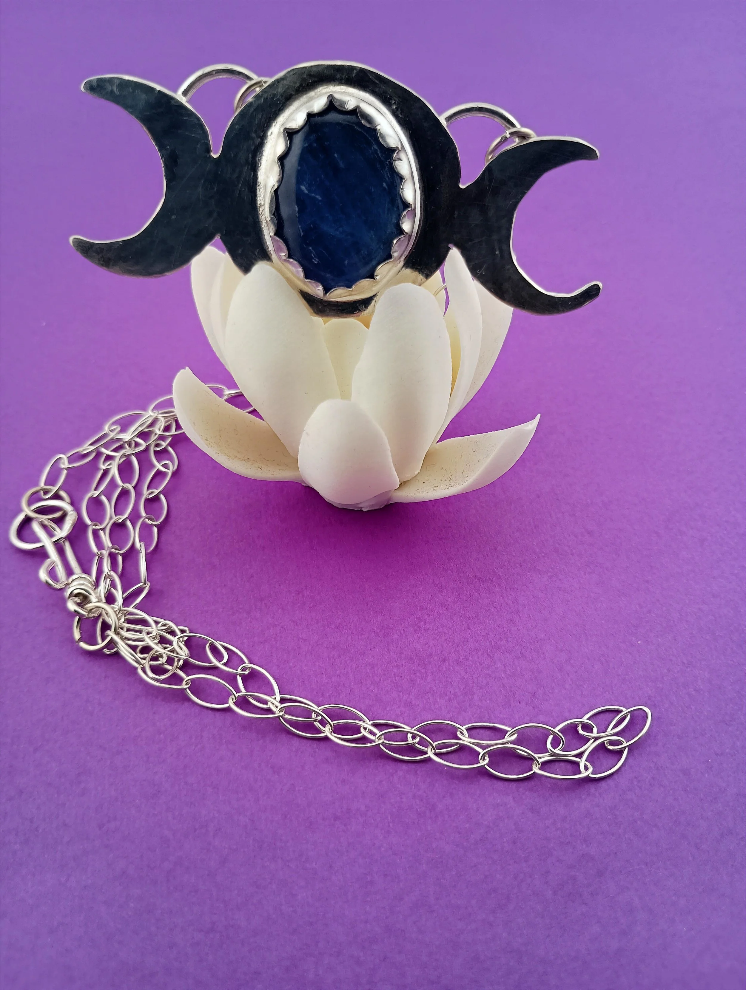 Kyanite TM purple background white lotus view 2.JPG