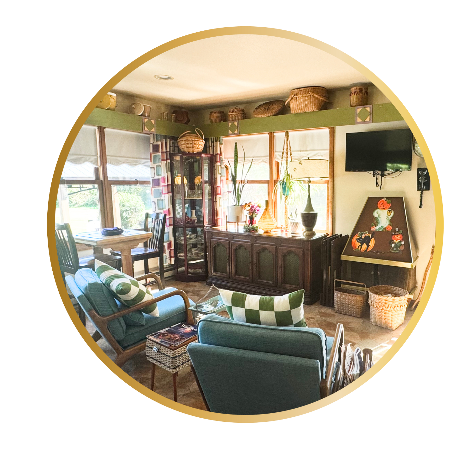 Cozy living room with vintage furniture, green accents, decorative baskets on the shelf, and large windows allowing natural light.