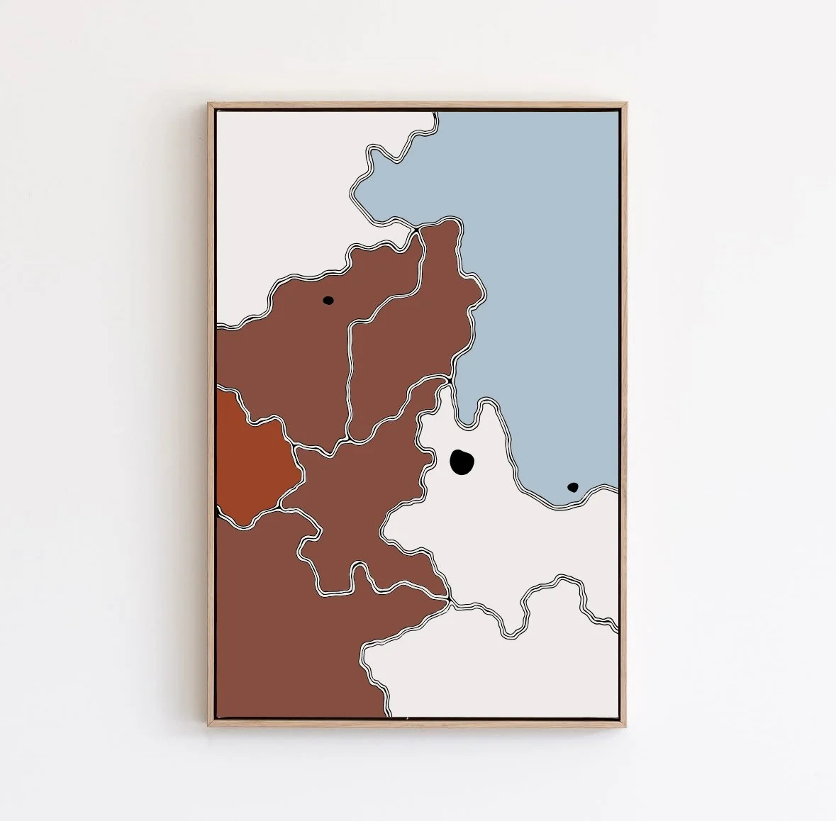 Abstract map art with colored regions, black dots, and white outline borders, framed on a white wall.