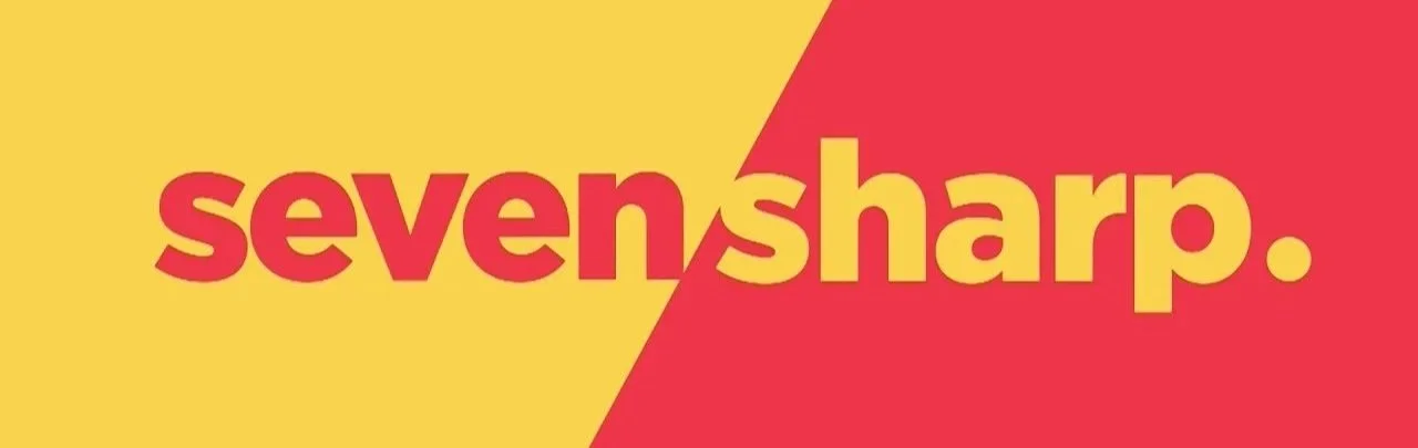 Graphic with yellow and red background divided diagonally, displaying the text 'seven sharp.' in bold red and yellow letters.