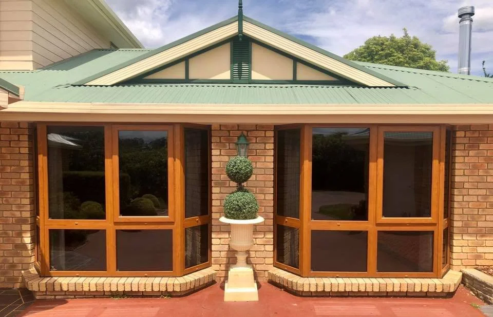 Special-order Golden Oak bay Windows in a Swiss village.