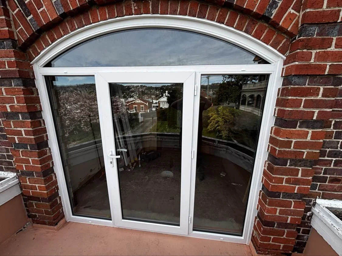 An arched design for a Juliet balcony.