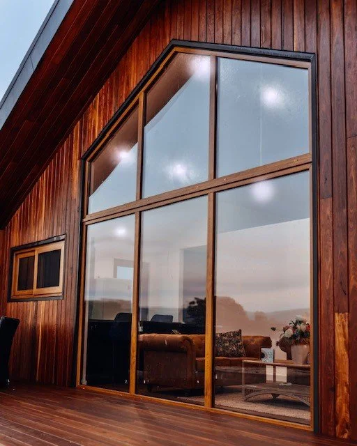 Special-order Golden Oak uPVC frames at dusk.
