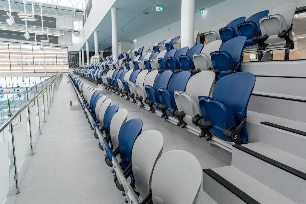 School sports facility seating. Fixed seating solutions