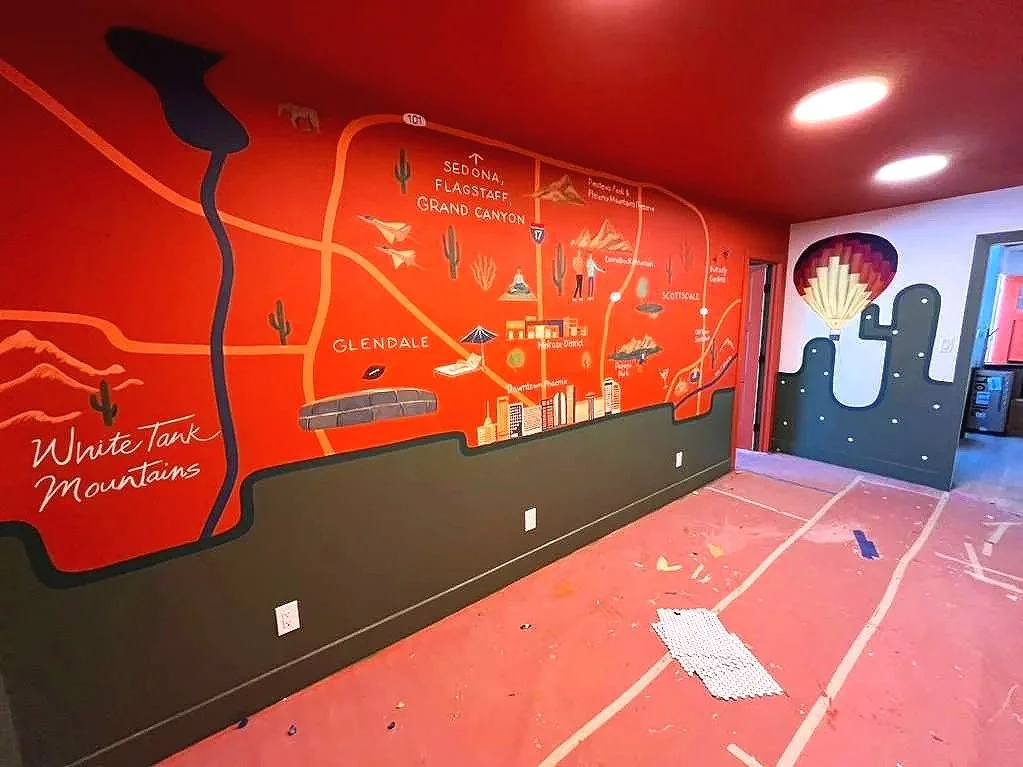 Custom Arizona road map and hot air balloon mural by Jade Bamford Murals for a Scottsdale Airbnb rental.