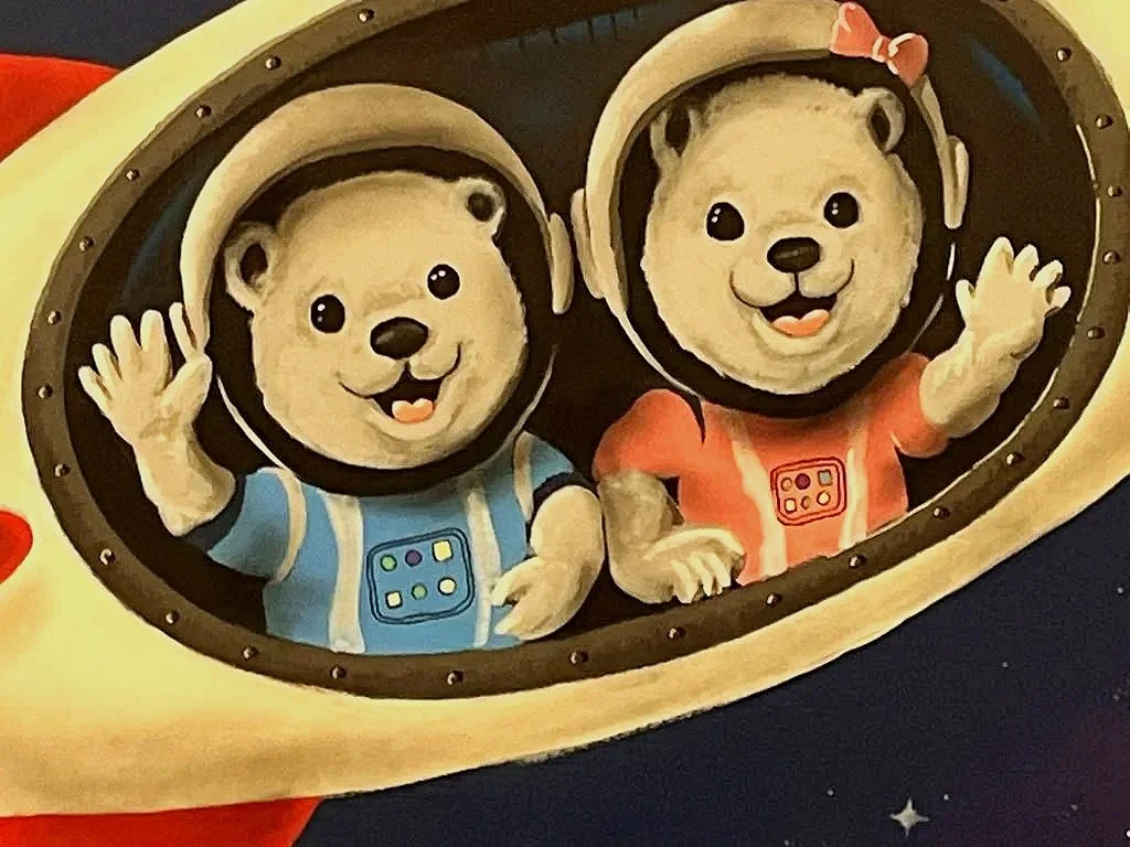 Custom space mural with astronaut bears and a rocket ship at Starlight Academy for Autistic Children in Mesa, Arizona