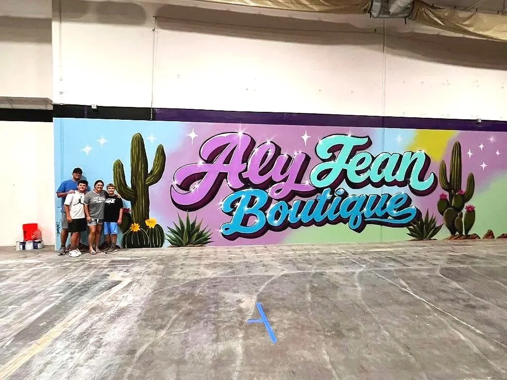 Custom hand-painted commercial wall mural for Aly Jean Boutique by Jade Bamford Murals in Mesa, Arizona.