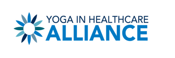 Logo for Yoga in Healthcare Alliance featuring a stylized blue flower and the organization name in blue text.