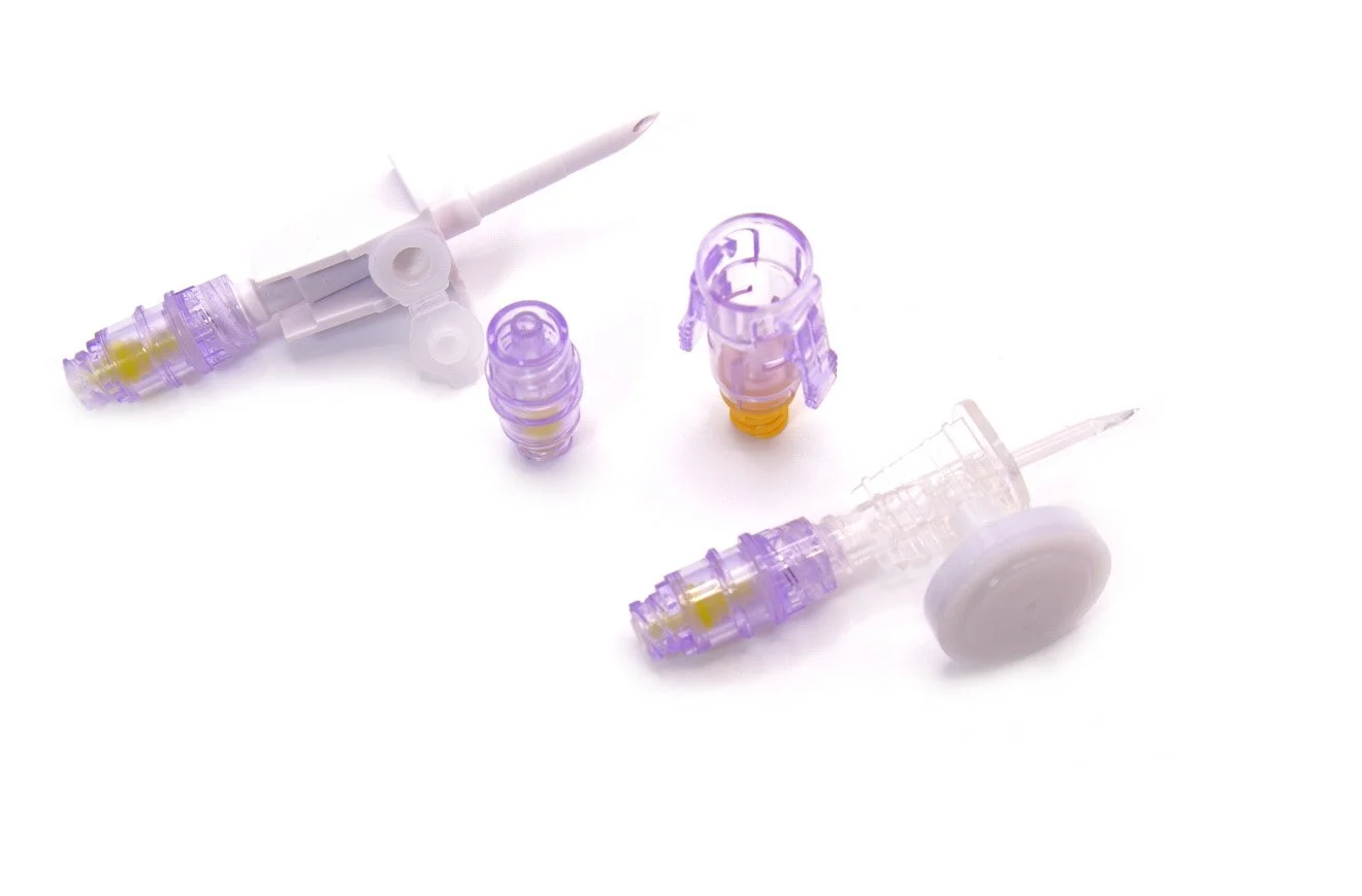 Medical syringes with purple caps and yellow seals on a white background.