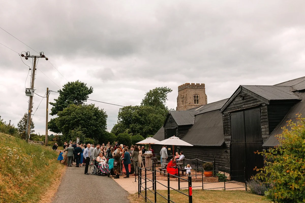  A photo of guests arriving in front on Alpheton hall barns   