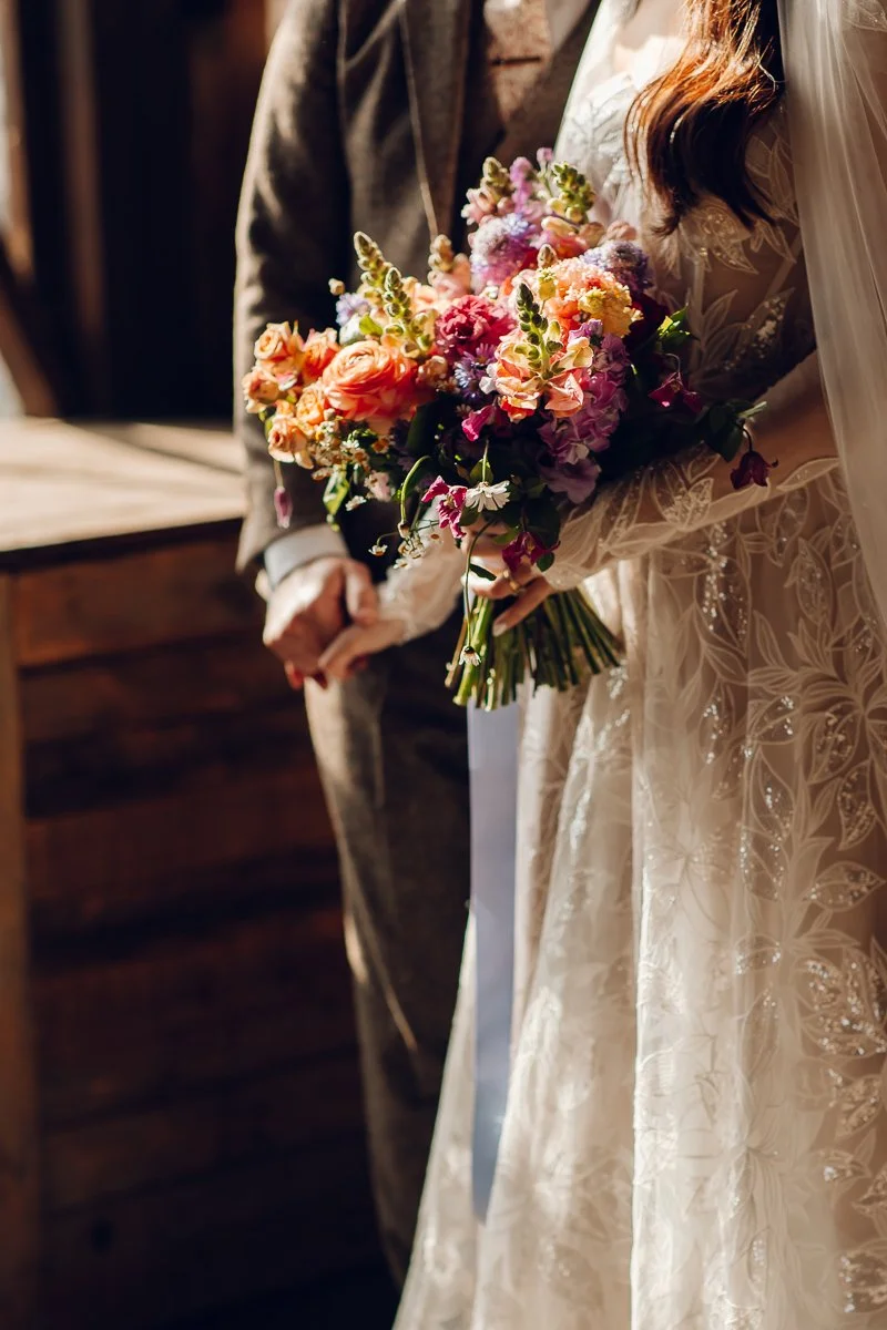  A close up of the bouquet being held by the bride at lodge farm barns 