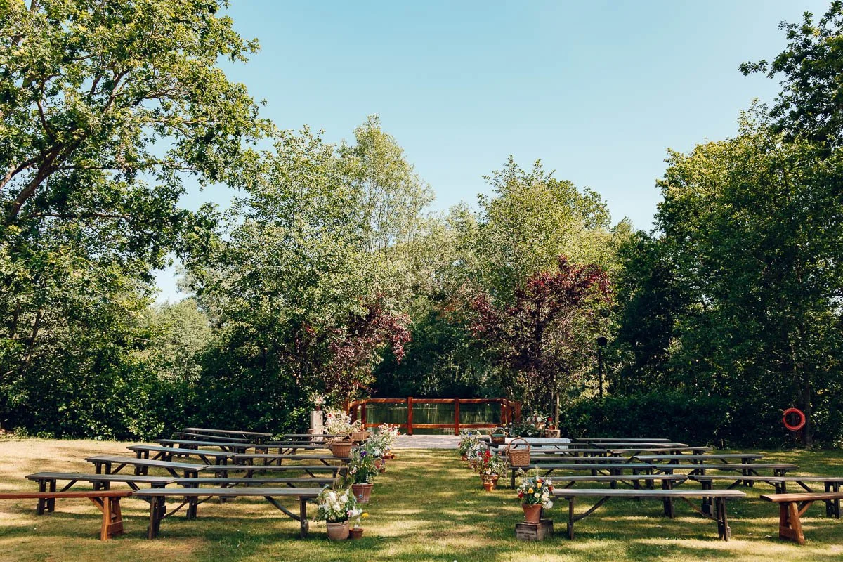 A Rustic outdoor ceremony set up at Chalkney Water Meadows, Browning Bros