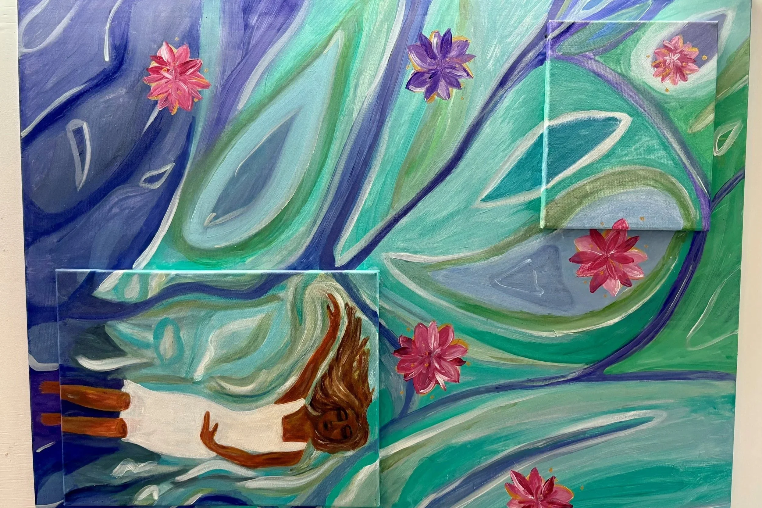 A colorful painting featuring swirling blue, green, and purple abstract background with pink and purple flowers and a tree with brown trunk and branches.
