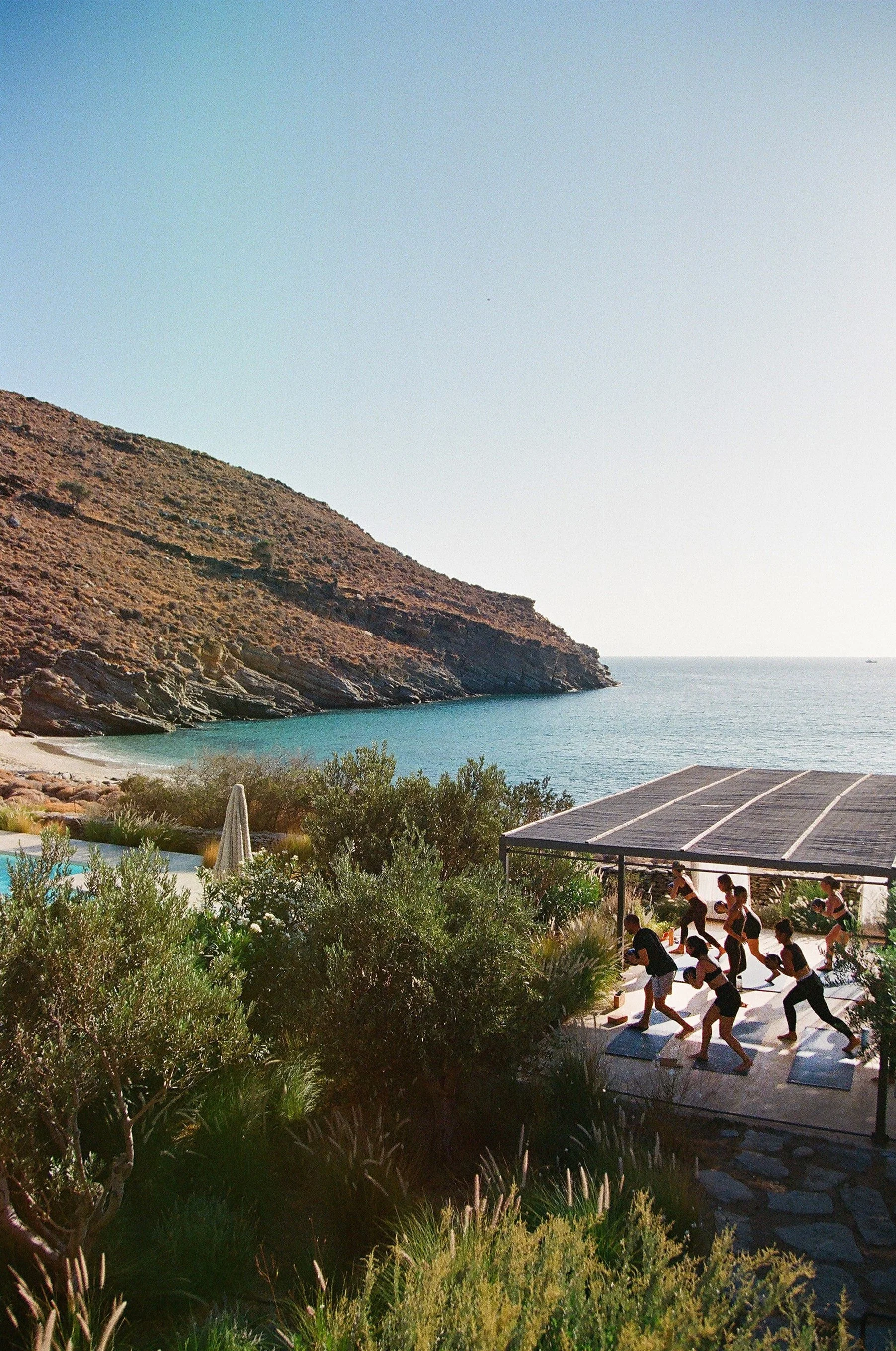 Group of people doing yoga, KEA retreat Greece