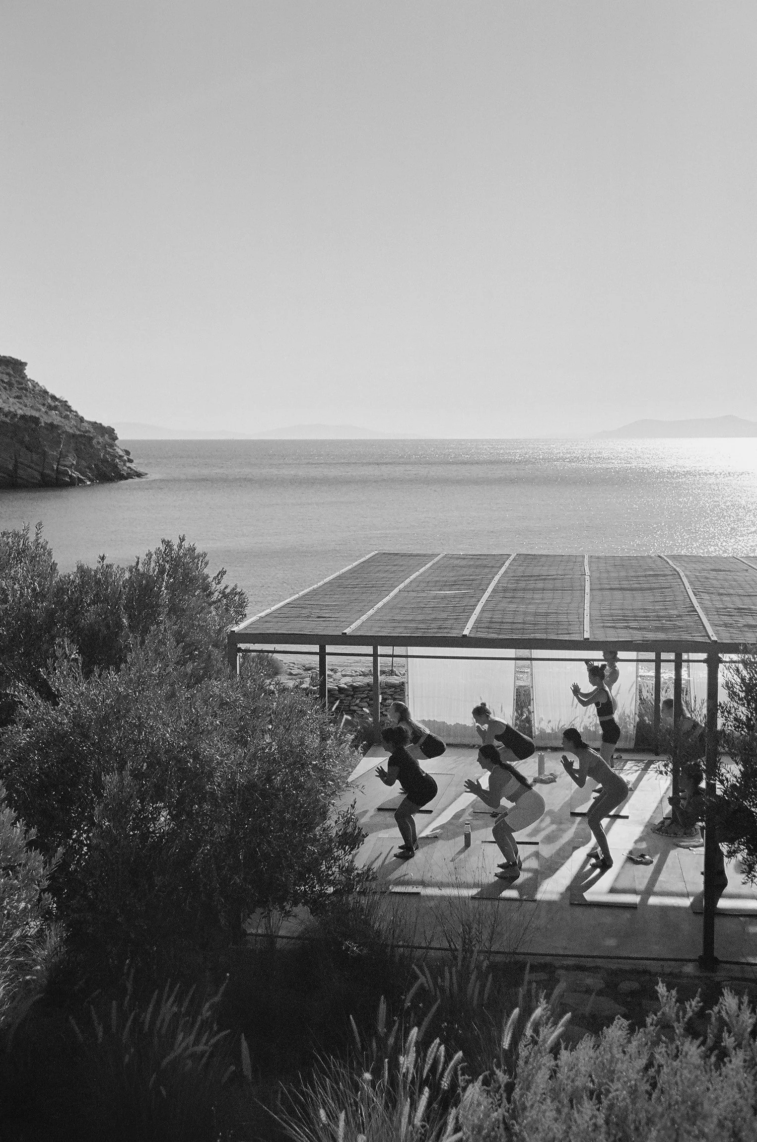 RETREATS. Group of people doing yoga in KEA