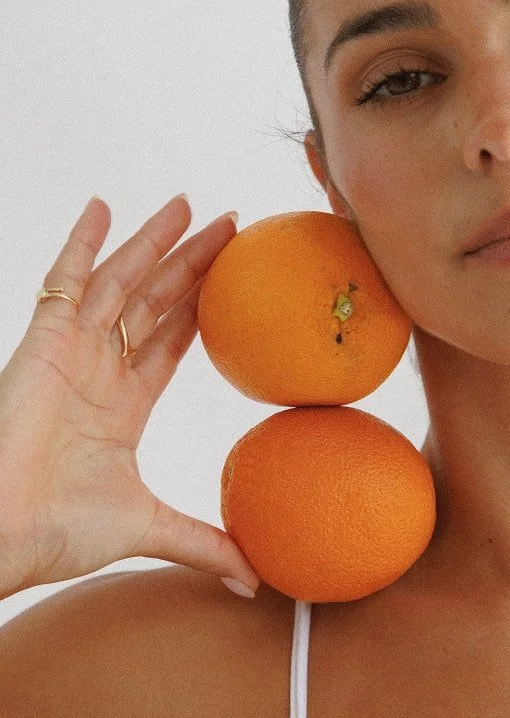 NUTRITION. Bianca balancing 2 oranges on her shoulder