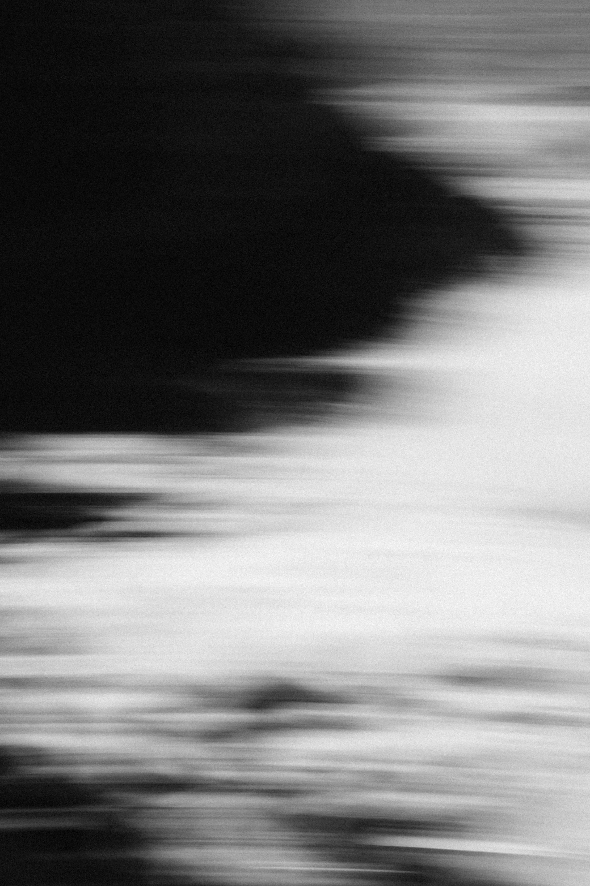 Abstract black and white blurred motion background
