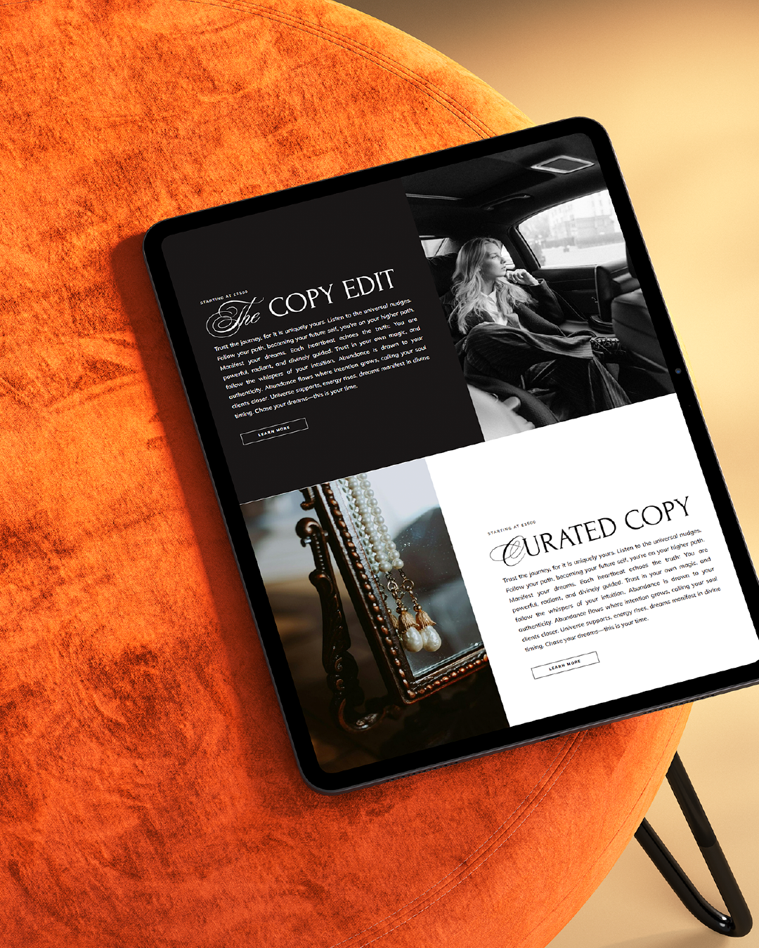 A tablet displaying two sections of a website, resting on an orange textured surface.