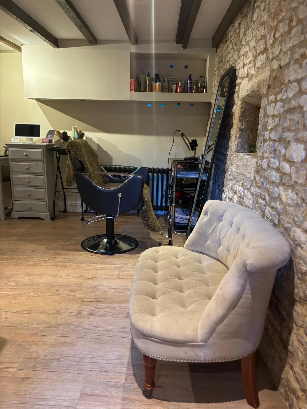 Boutique hair salon space at Francesca Alexander Hair, in Stamford with mirror and styling station.