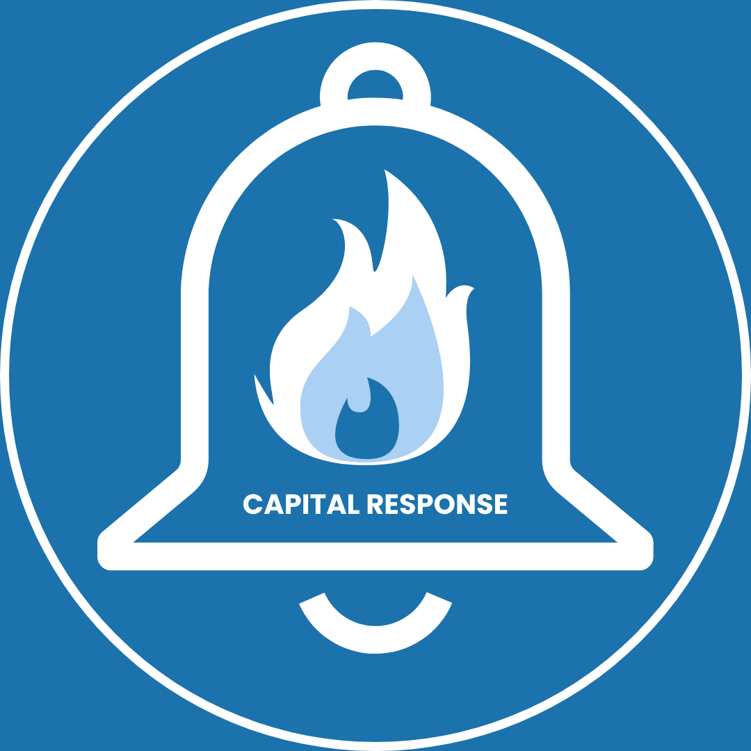 A blue circular safety icon with a white outline of a bell containing a flame symbol. The text "CAPITAL RESPONSE" is written below the flame inside the bell, indicating fire and life systems.