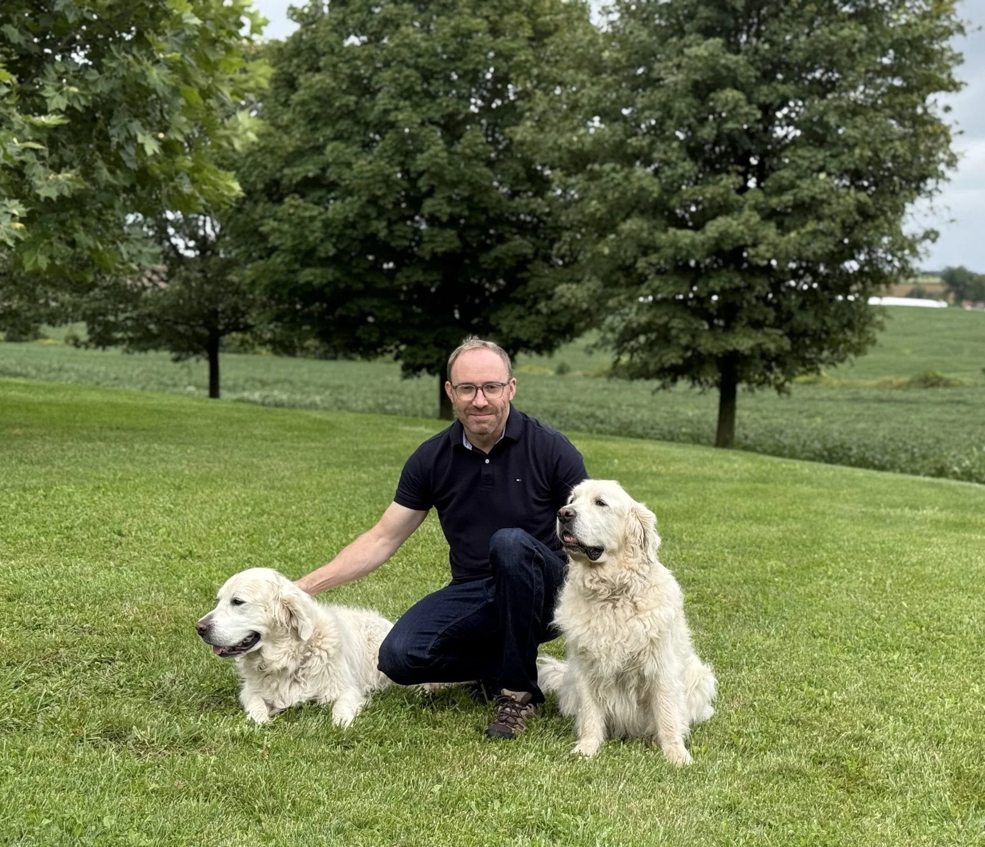 David Le Roy with his dogs in a park