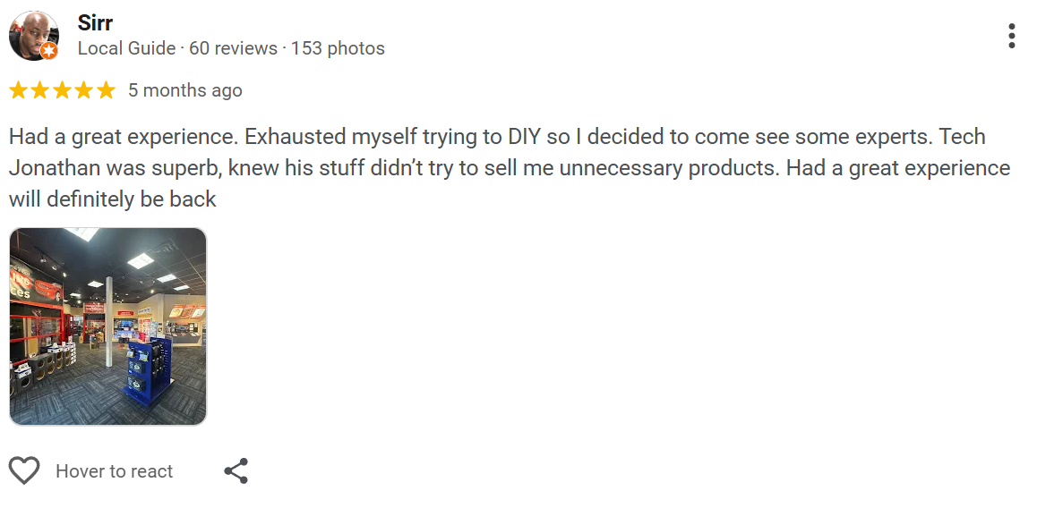 Photo of an electronics or appliance store interior showing shelves with various products.