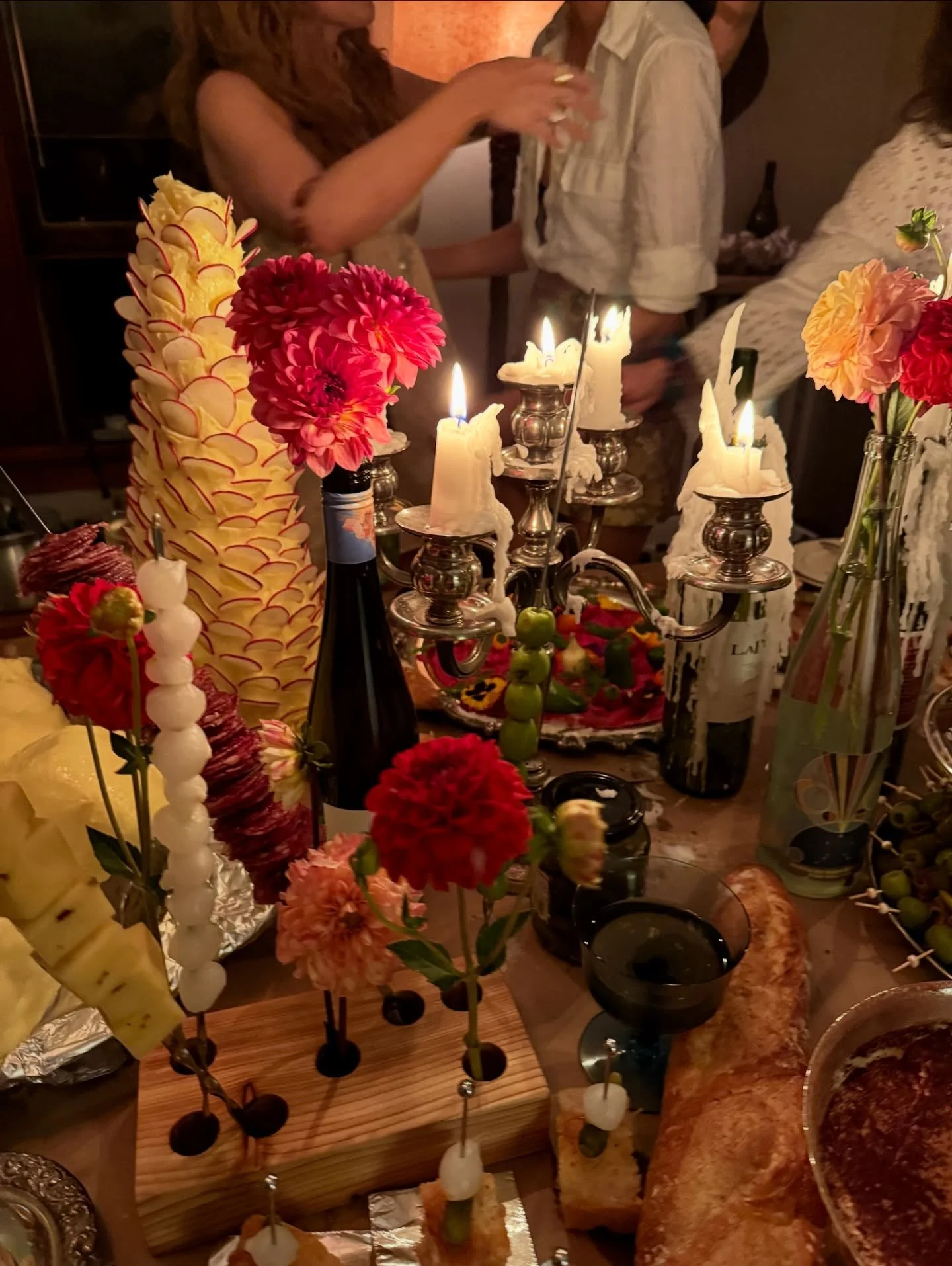 Wax drips, silver gleams, and a butter torso. 
@dontcookforcowboys conjured another incredible gathering and our candelabras and stands were part of it- silver, flame, and temptation.
.
#boutiquerentals #specialtyrentals #madisonwi #madisonwisconsin 