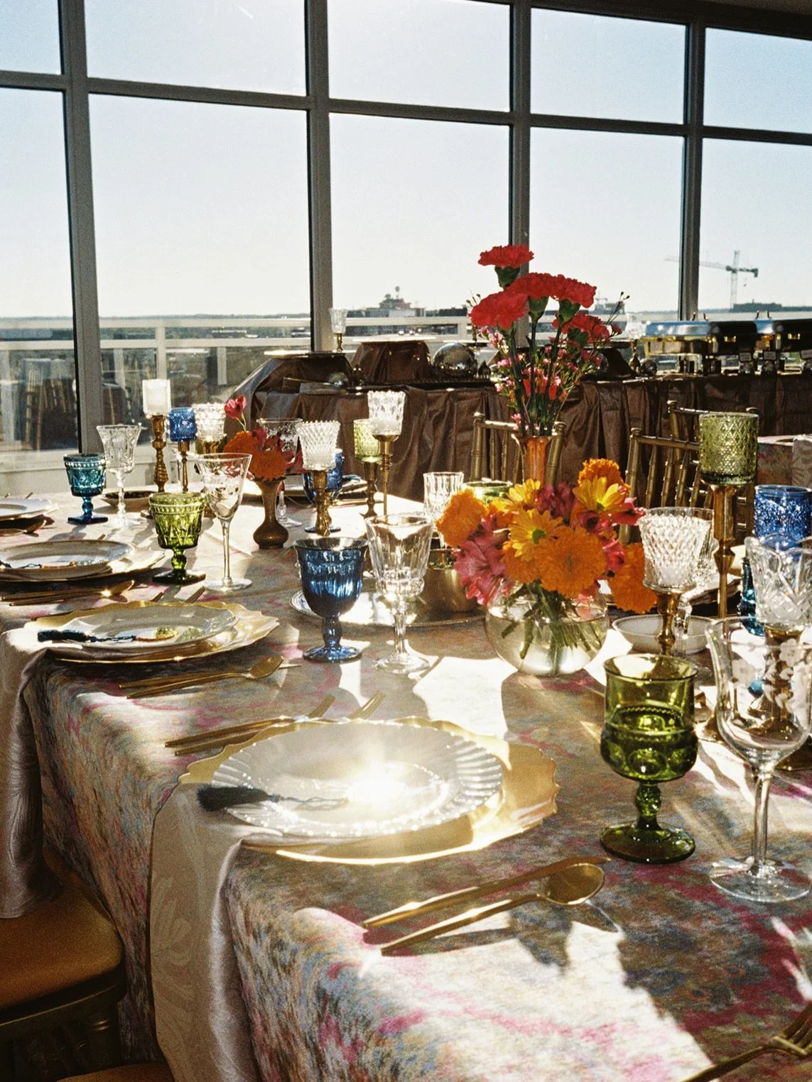 A tablescape that glows at golden hour ✨
Layered textures, jewel-tone glassware, vintage brass, and bohemian blooms that bring the scene to life.
.
Photography @courtneybreiderphoto 
Rentals (lounge pieces, disco balls, glassware, flatware, vases, ca