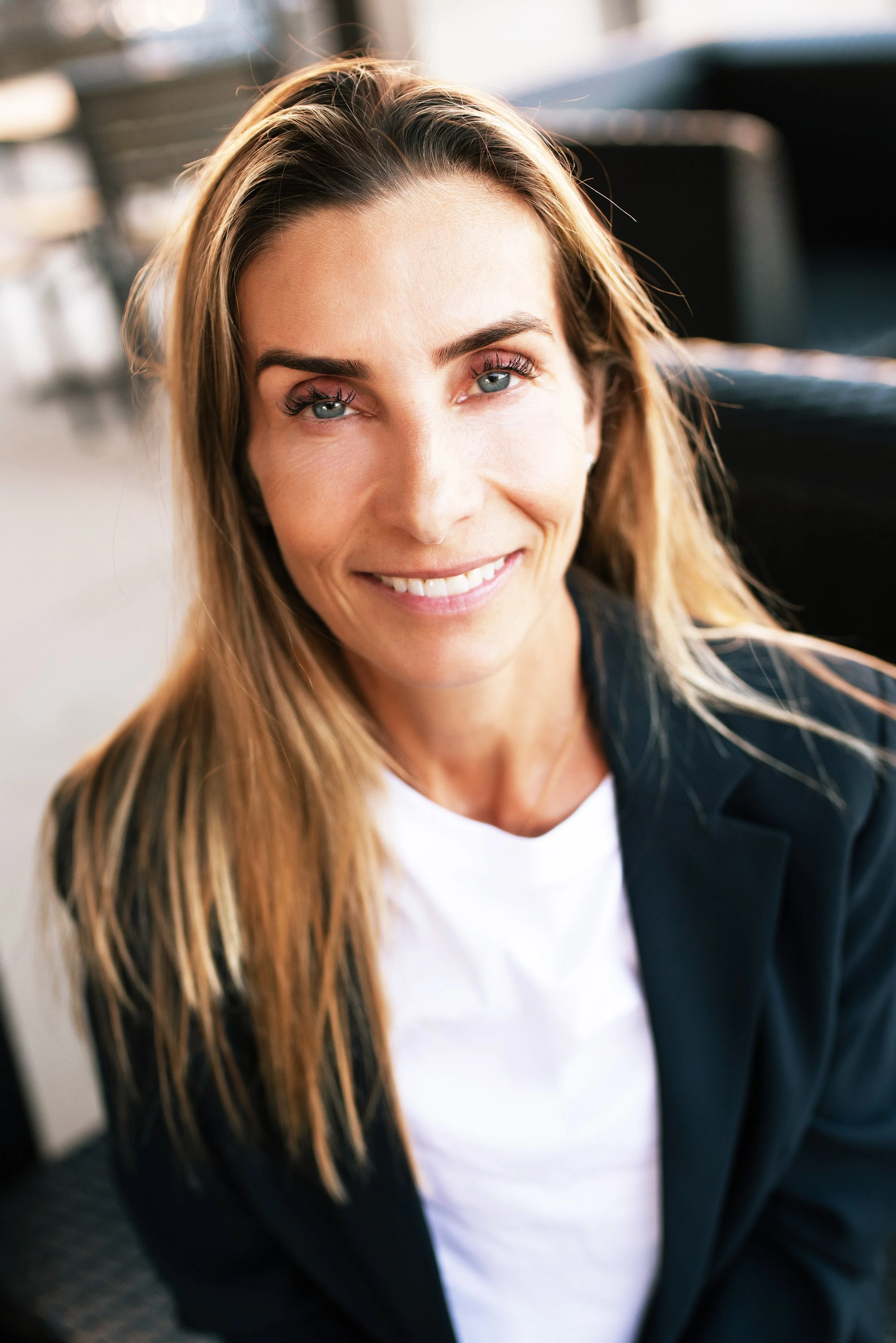 A golden eight-pointed star ornament with a textured surface, set against a black background.