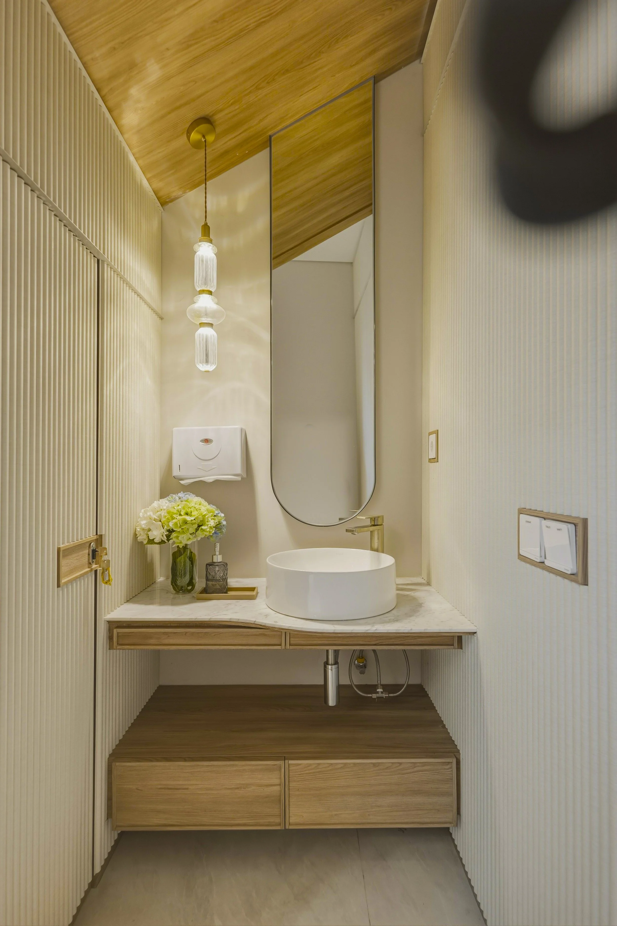 Very Convenient Powder Room area with marble countertop.