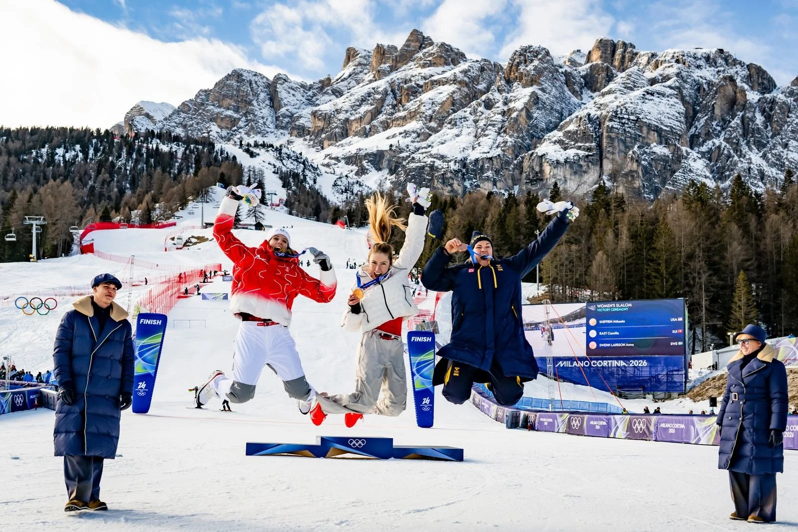 Gold medal winner Mikaela Shiffrin (C) of USA, silver medal winner Camille Rast (L) of Switzerland and bronze medal winner Anna Swenn Larsson (R) of Sweden celebrate on the podium  (Copy)