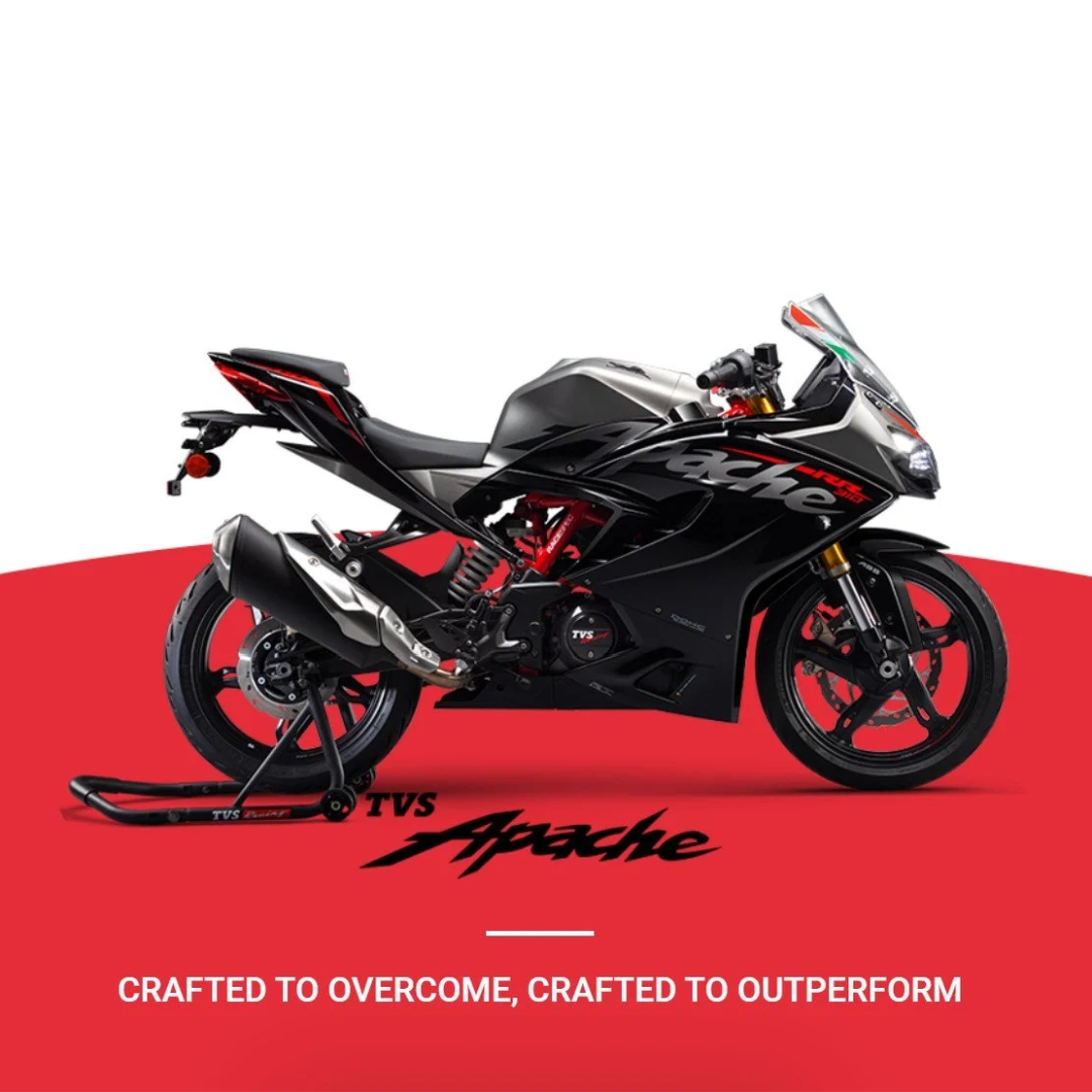 A black and silver racing motorcycle on a red and white background with 'TVS Apache' branding and the slogan 'Crafted to Overcome, Crafted to Outperform'.