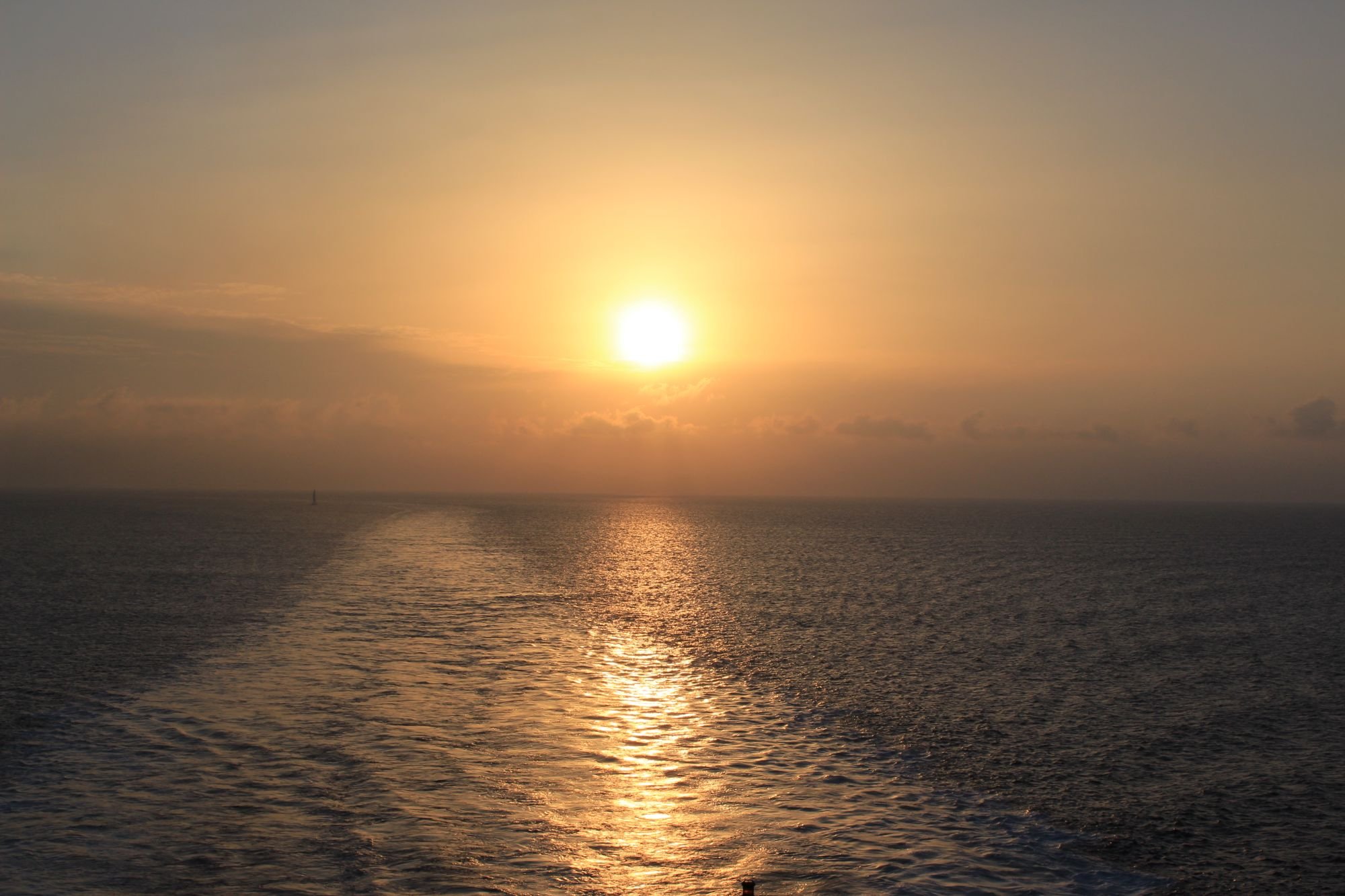 Sunset over the sea horizon