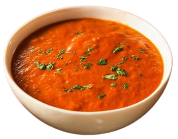 Bowl of tomato soup garnished with chopped herbs.