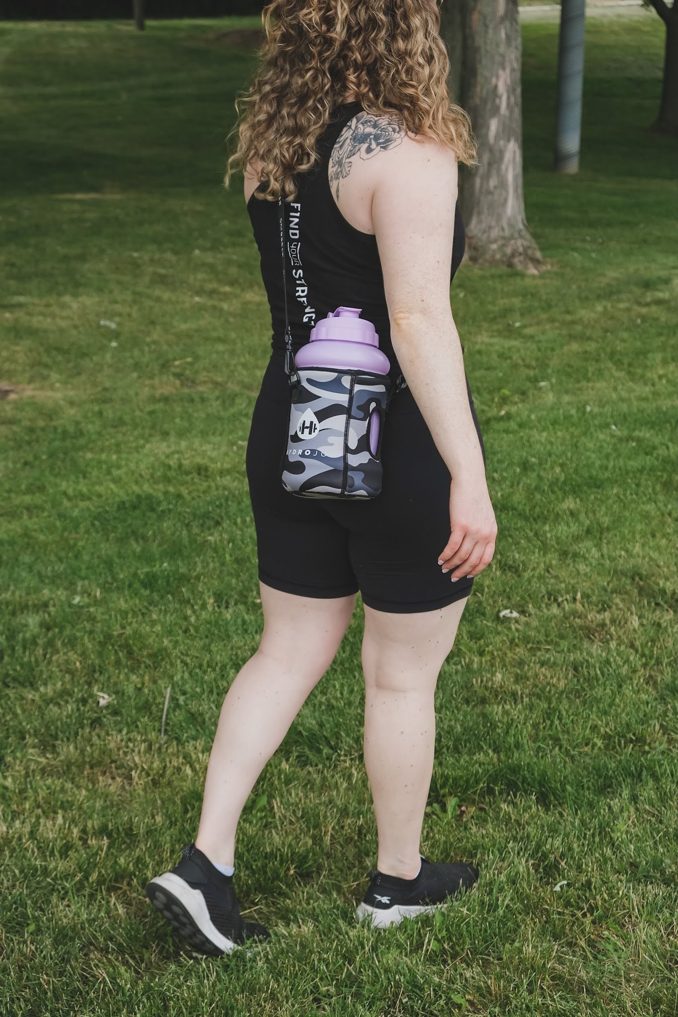 Women's strength coach in Brantford carrying a water bottle in the park