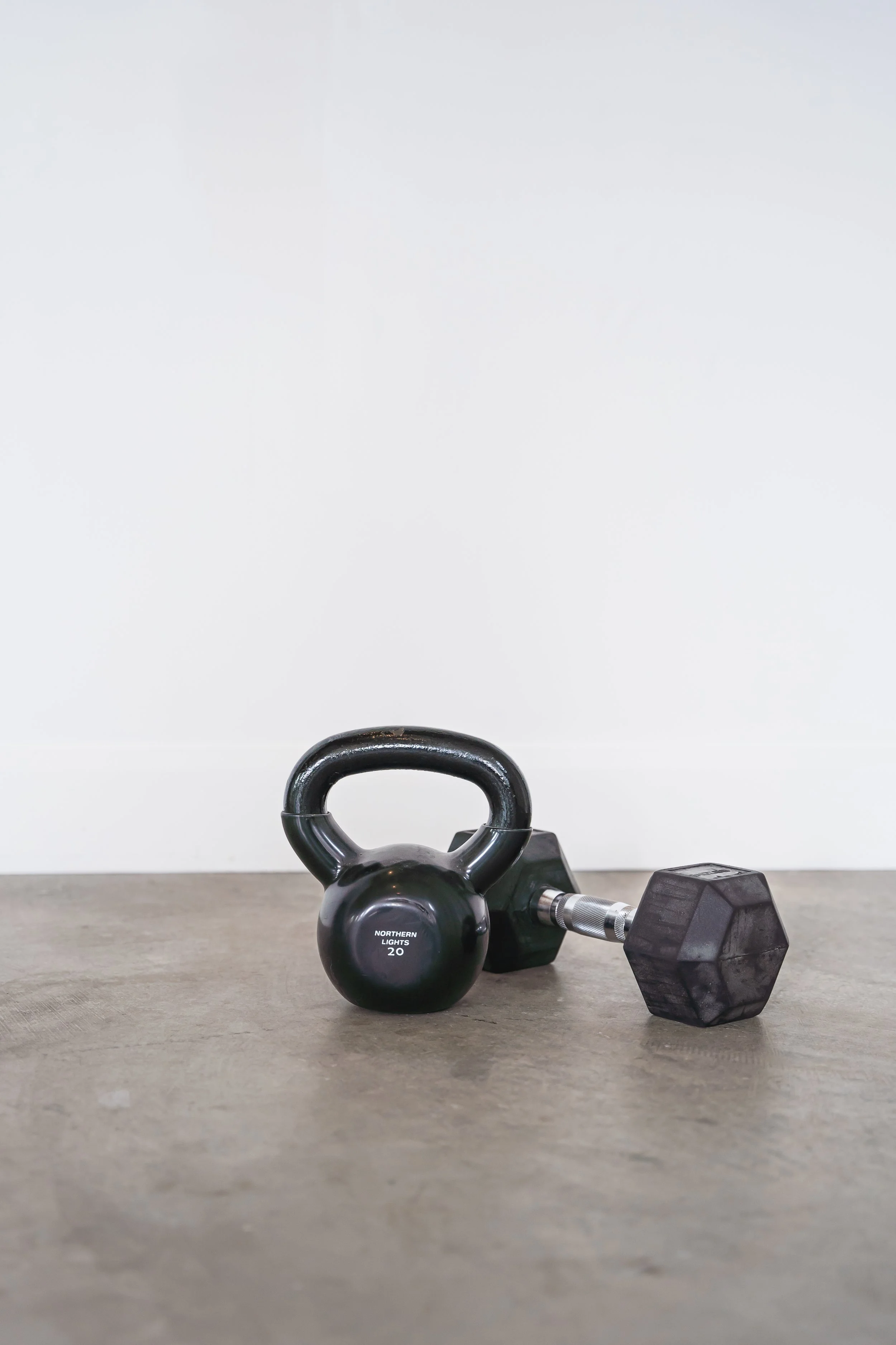 A Women's Weightlifting Coach in Brantford Ontario's kettlebell and dumbbell